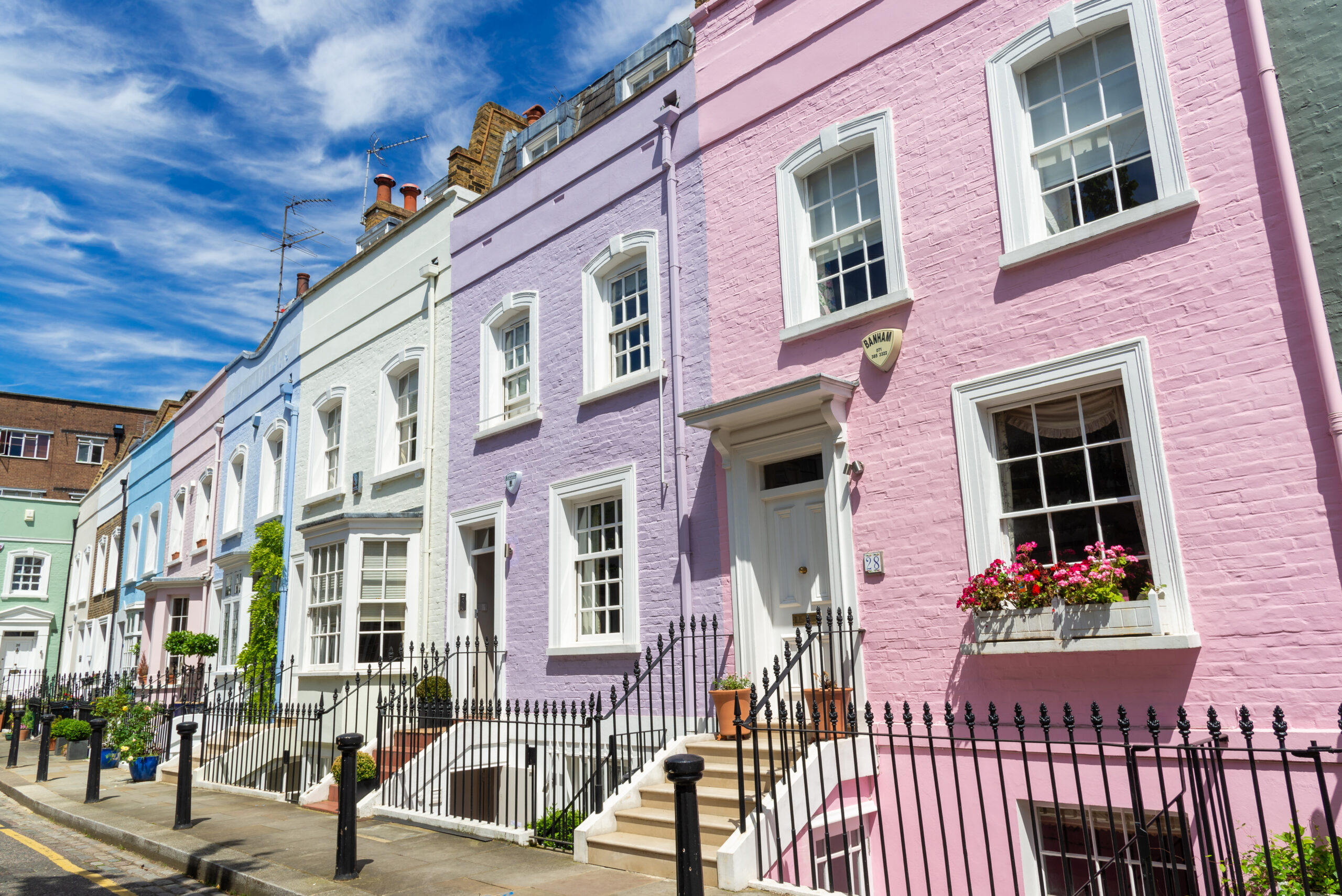Colourful terraced town houses on Bywater Street, Chelsea, London, England, UK